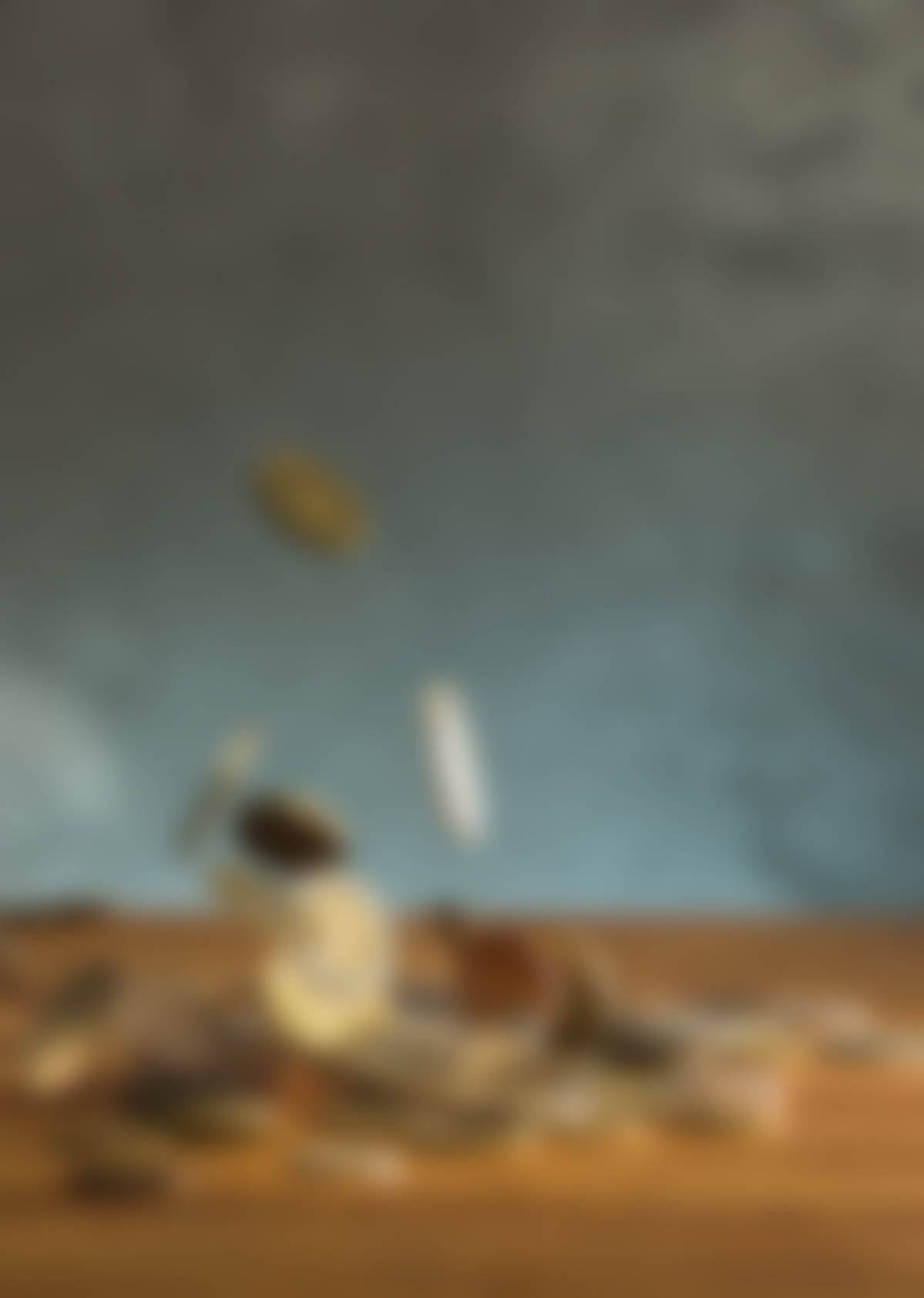 The silver and golden coins and falling coins on wooden table background