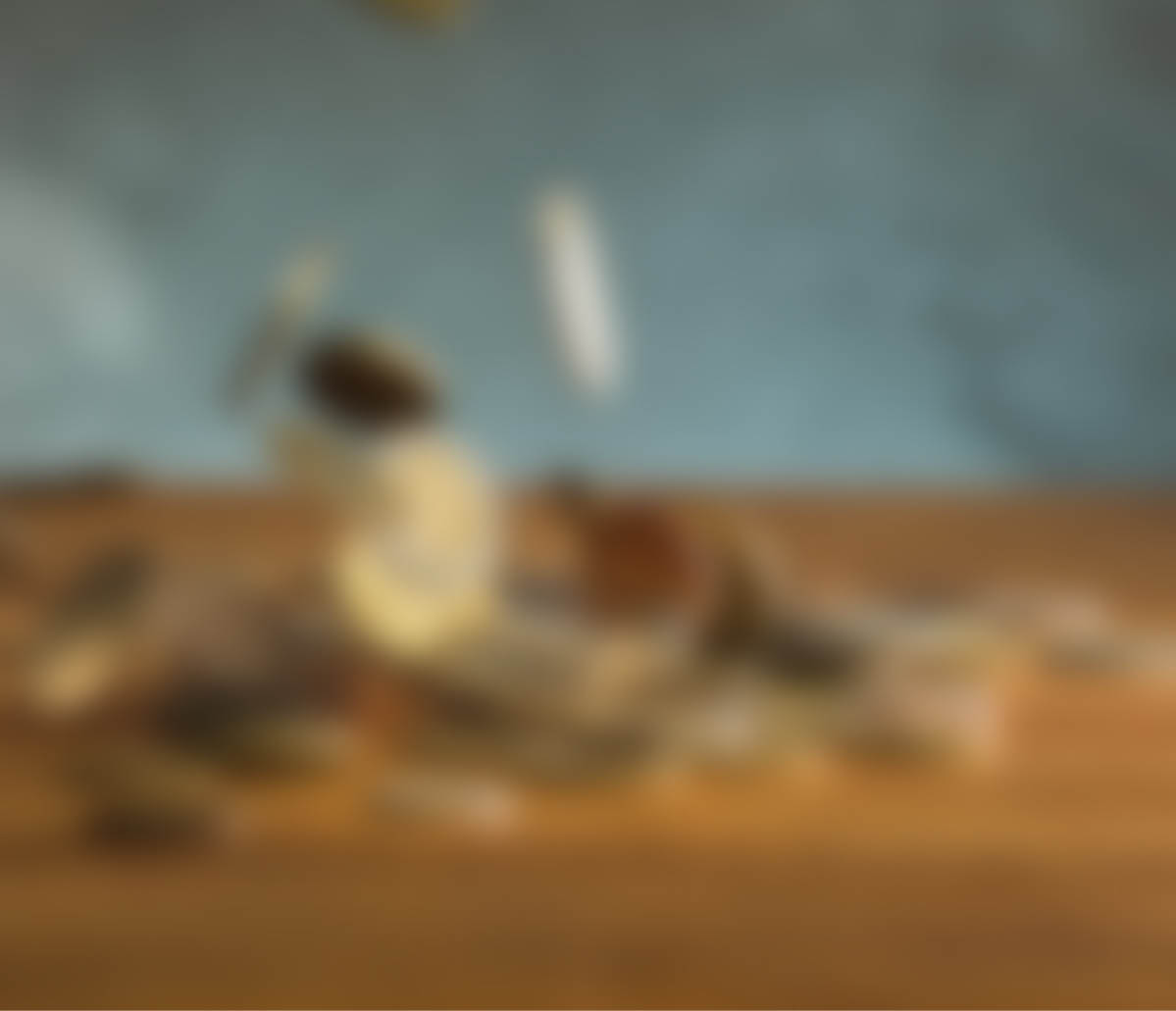 The silver and golden coins and falling coins on wooden table background